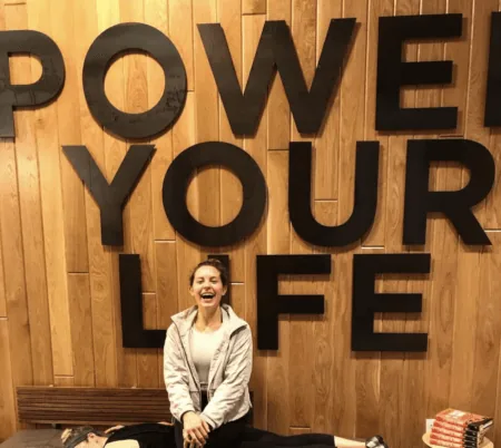 chelsea rofles nurse in fitness center sitting smiling