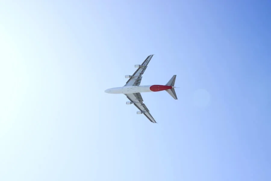 plane in sky on blue-sky background staff nurse to travel nurse